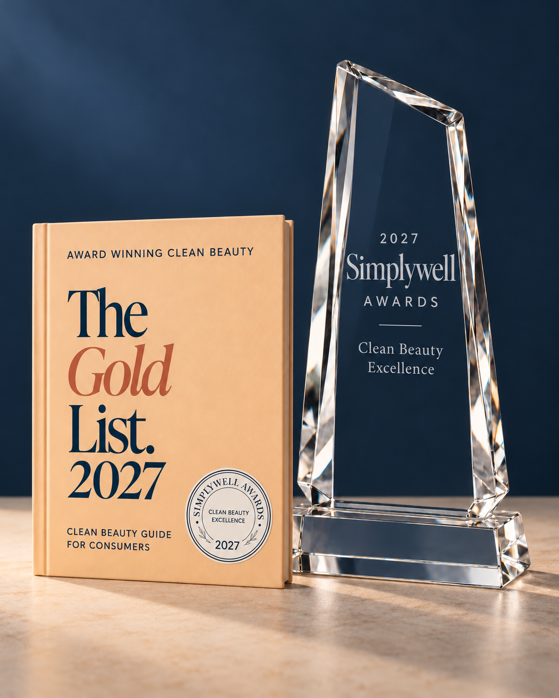 Simplywell crystal award beside The Gold List 2027 clean beauty guide for consumers, with the awards seal printed on its cover